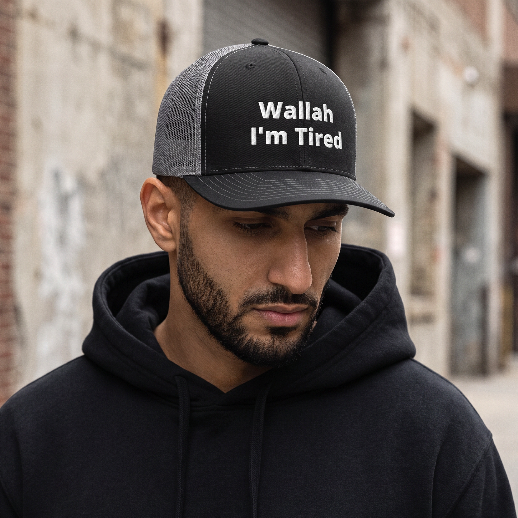 Wallah I'm Tired trucker cap in black and charcoal, front view, Arabic humor snapback by BOSA