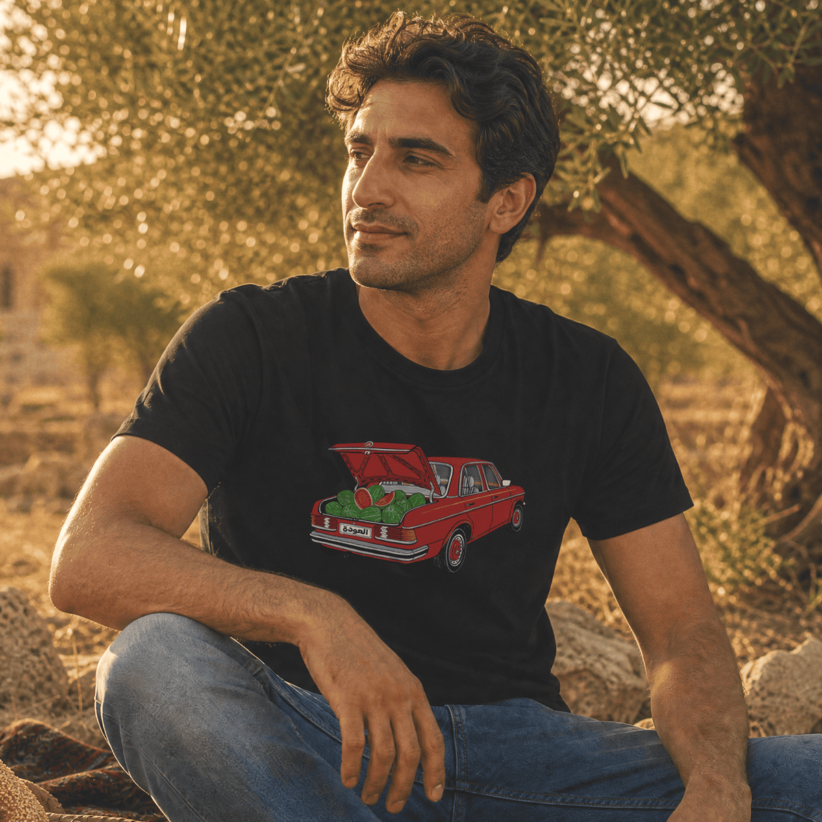 Model wearing Awda watermelon short sleeve t-shirt in black, Palestinian heritage streetwear by BOSA