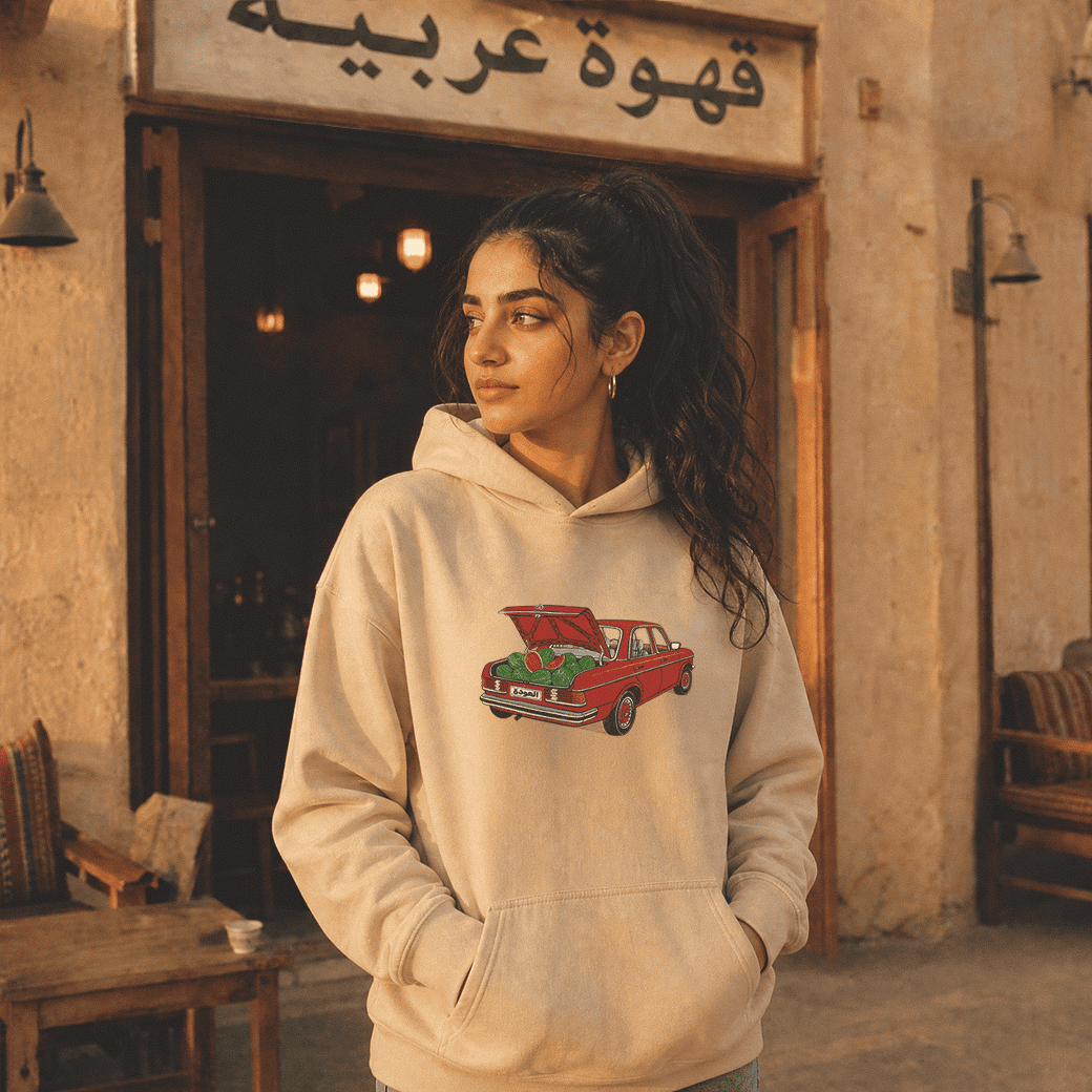 Woman wearing Awda watermelon unisex hoodie, Palestinian heritage streetwear by BOSA
