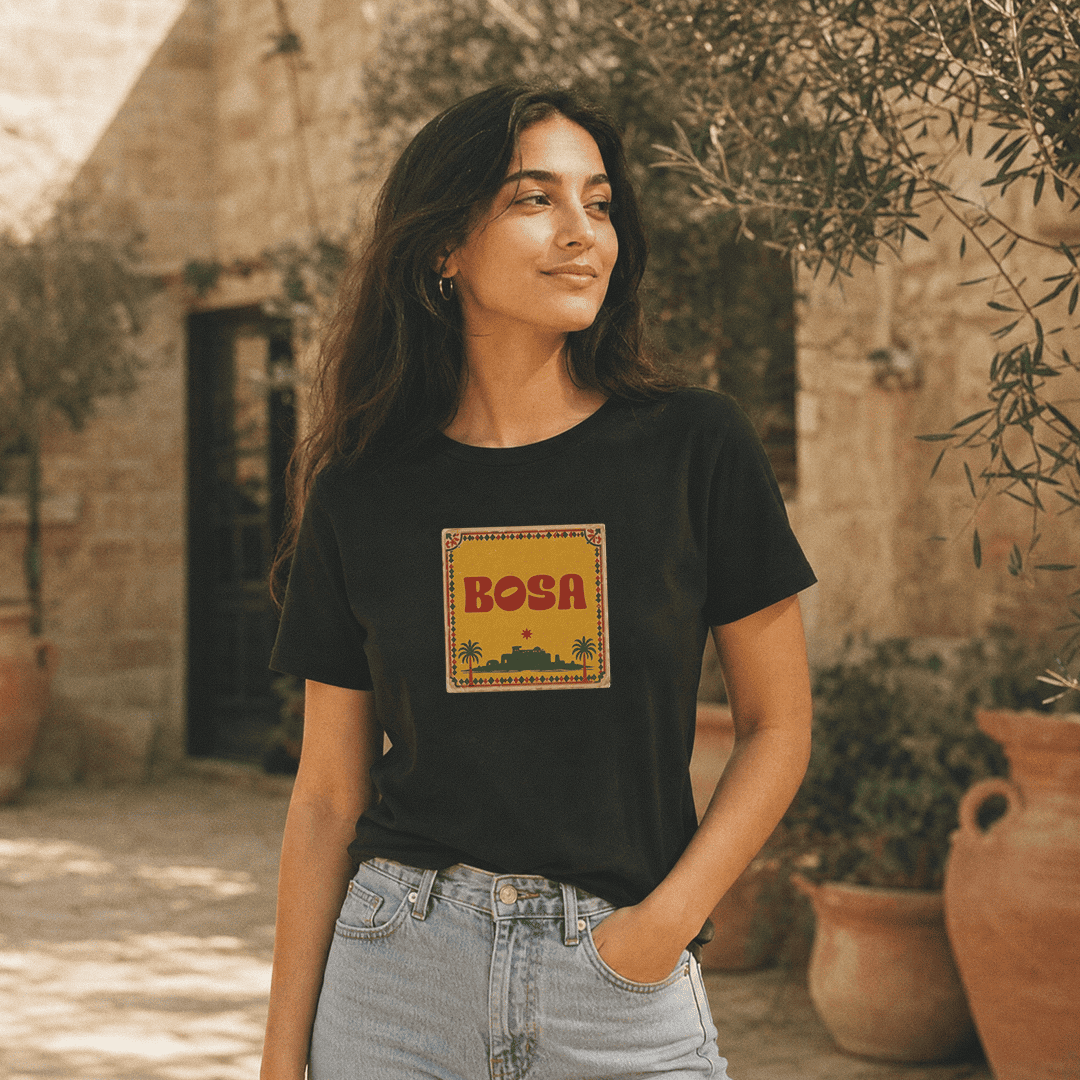 Model wearing BOSA logo unisex heavyweight t-shirt in black, Arab diaspora streetwear by BOSA