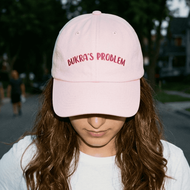Model wearing Bukra's Problem dad hat, Arab humor cap by BOSA