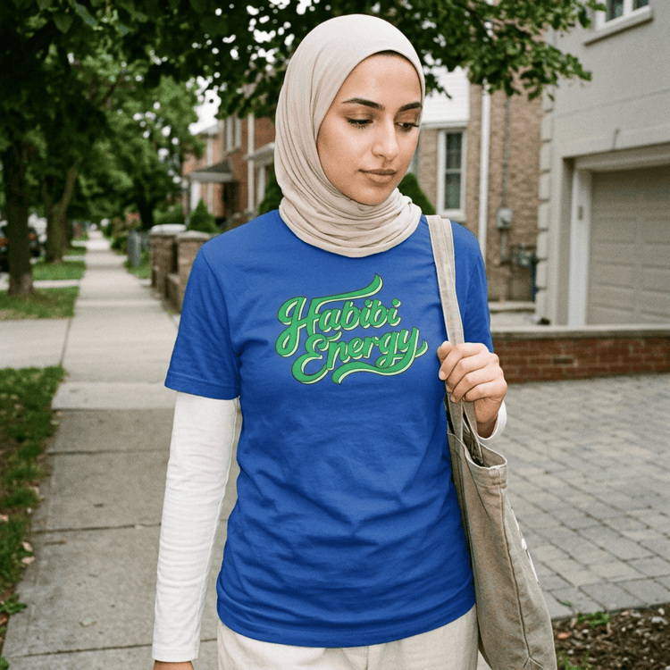 Model wearing Habibi Energy short sleeve t-shirt, side angle, Arabic slogan streetwear by BOSA