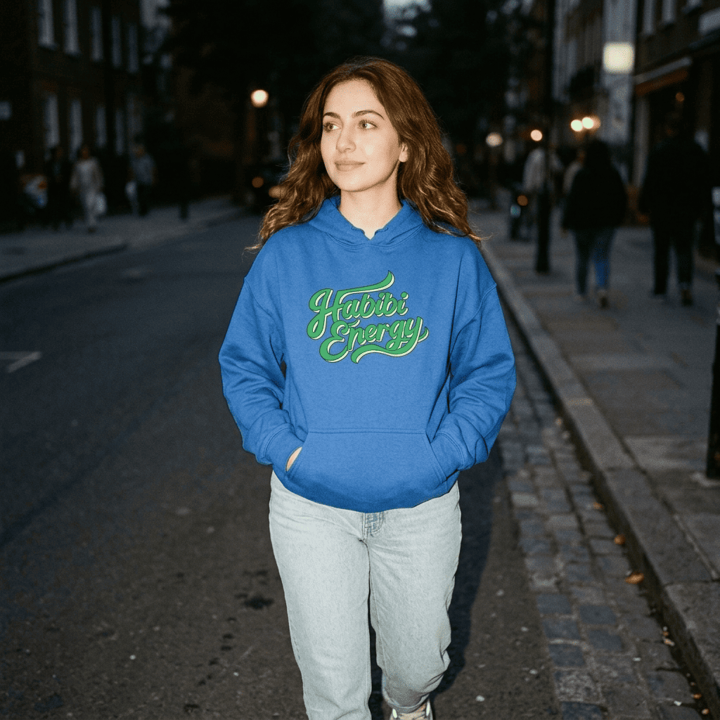 Model wearing Habibi Energy unisex hoodie, side angle, Arabic slogan streetwear by BOSA