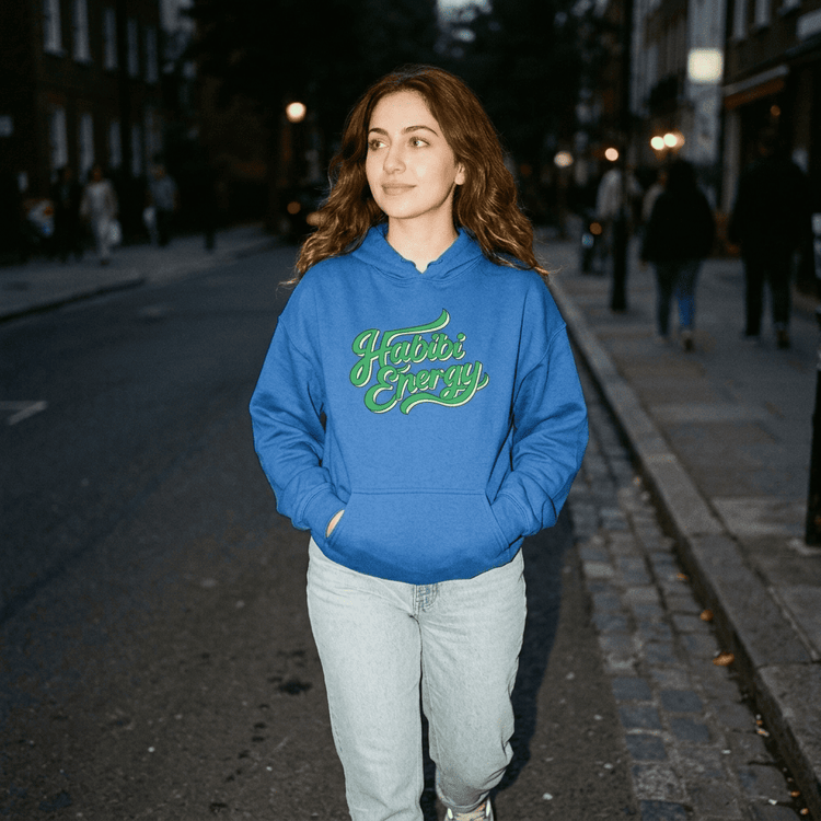 Model wearing Habibi Energy unisex hoodie, side angle, Arabic slogan streetwear by BOSA