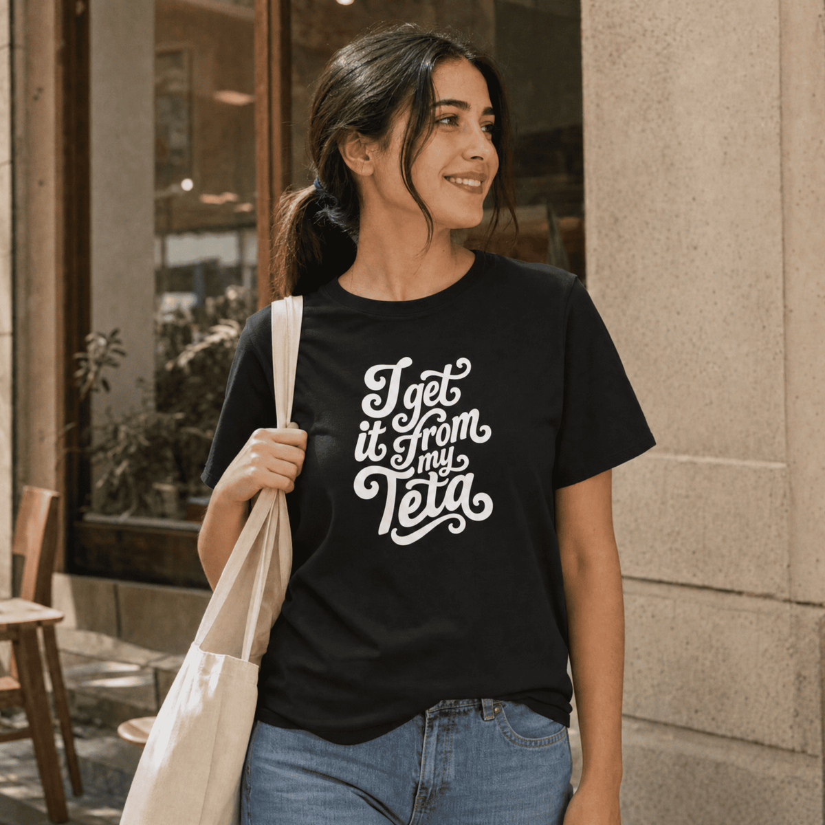 Model wearing I Get It From My Teta organic cotton t-shirt, Arab grandmother slogan streetwear by BOSA