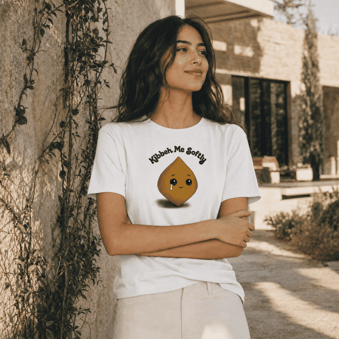 Model wearing Kibbeh Me Softly heavyweight t-shirt, side angle, Arab food humor streetwear by BOSA