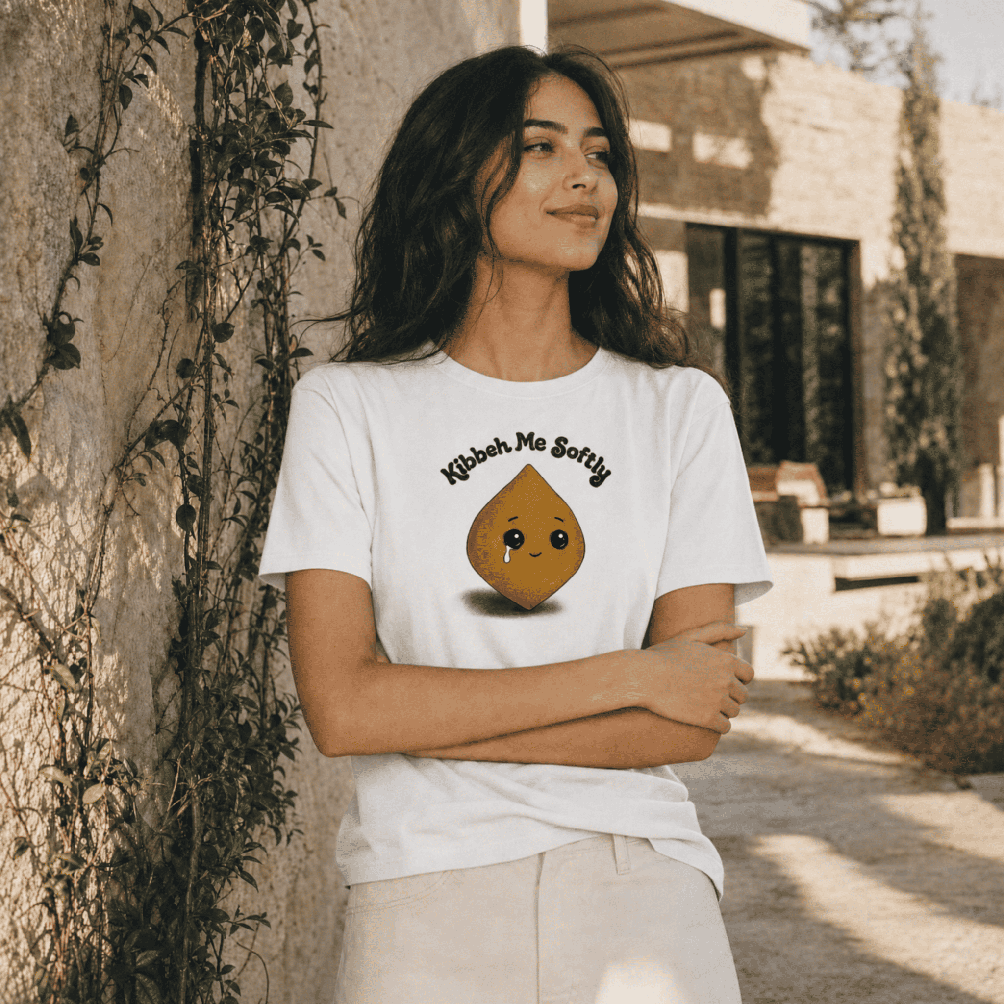 Model wearing Kibbeh Me Softly heavyweight t-shirt, side angle, Arab food humor streetwear by BOSA
