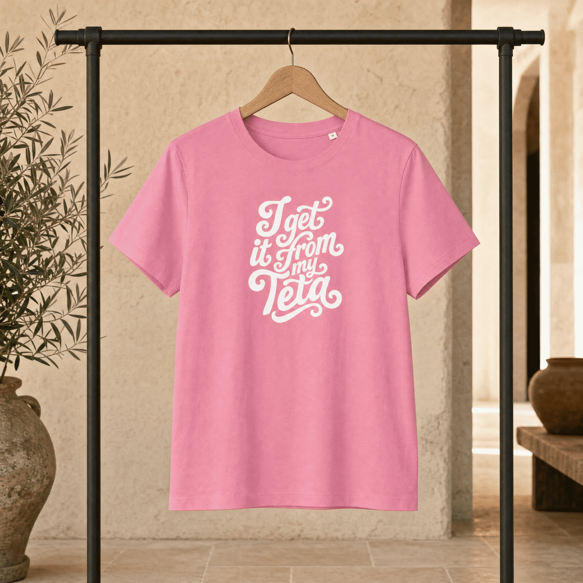 Woman wearing I Get It From My Teta organic ribbed t-shirt, side angle, Arab grandmother slogan streetwear by BOSA
