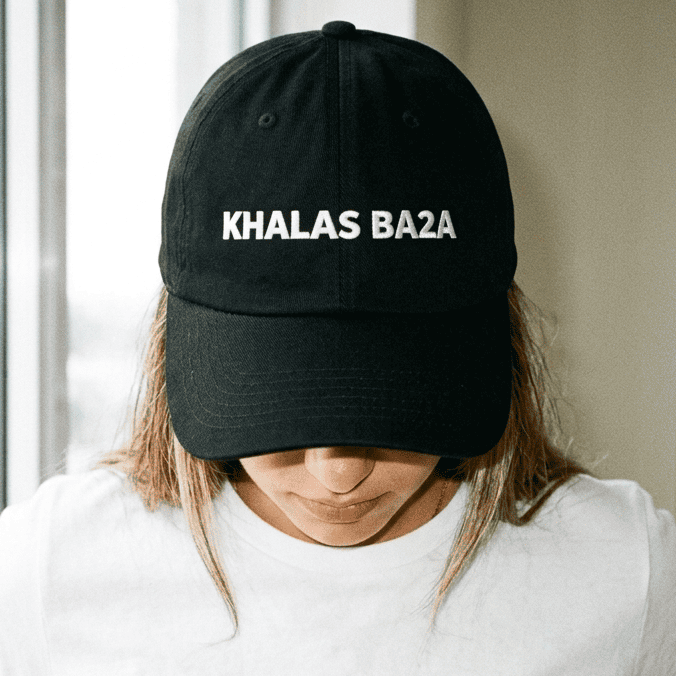 Model wearing Khalas Ba2a dad hat, Arabic slogan cap by BOSA
