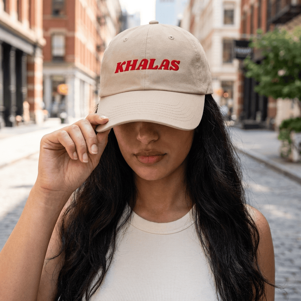Model wearing Khalas dad hat, Arabic slogan cap by BOSA