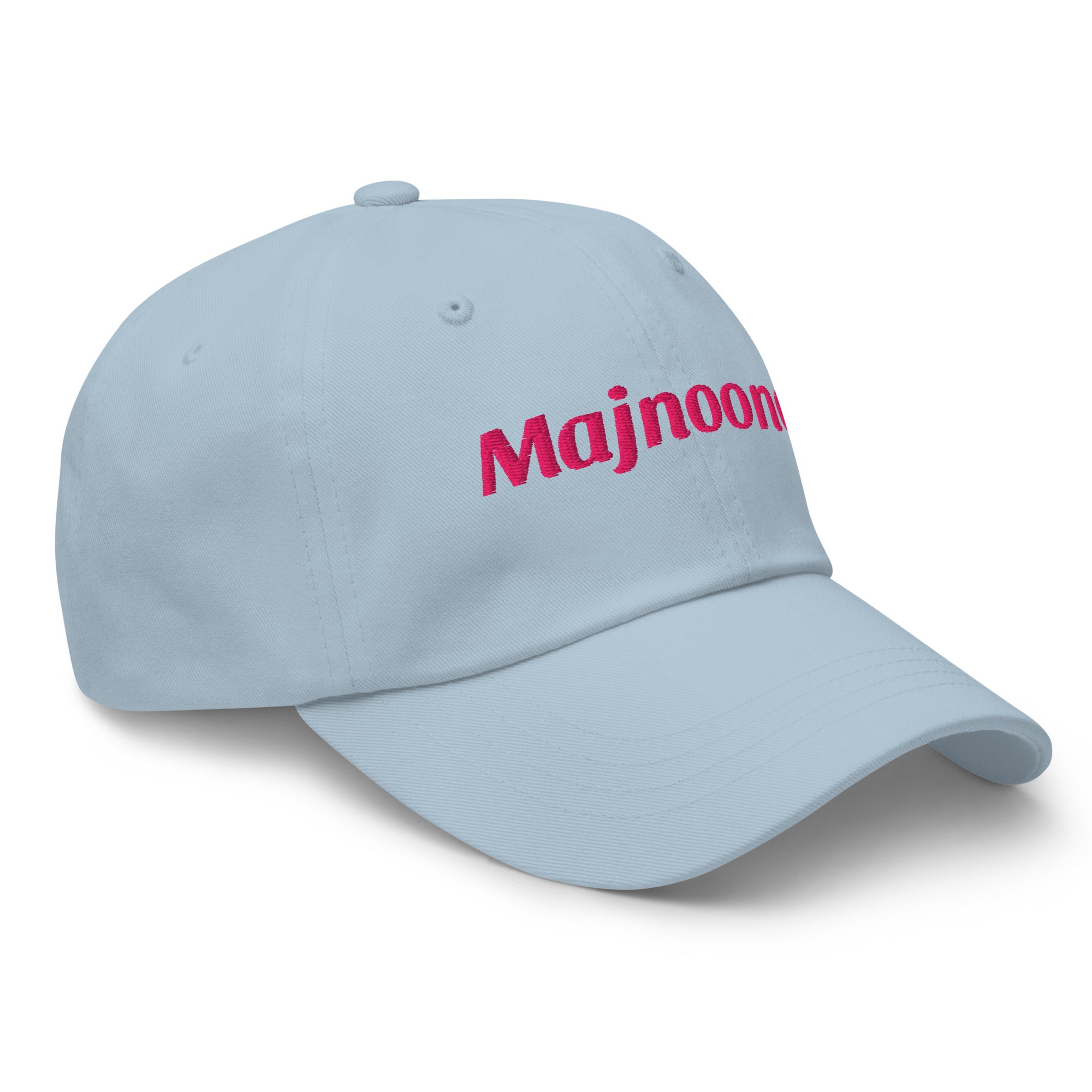 Majnoona embroidered dad hat in light blue, side angle, Arabic slogan cap by BOSA