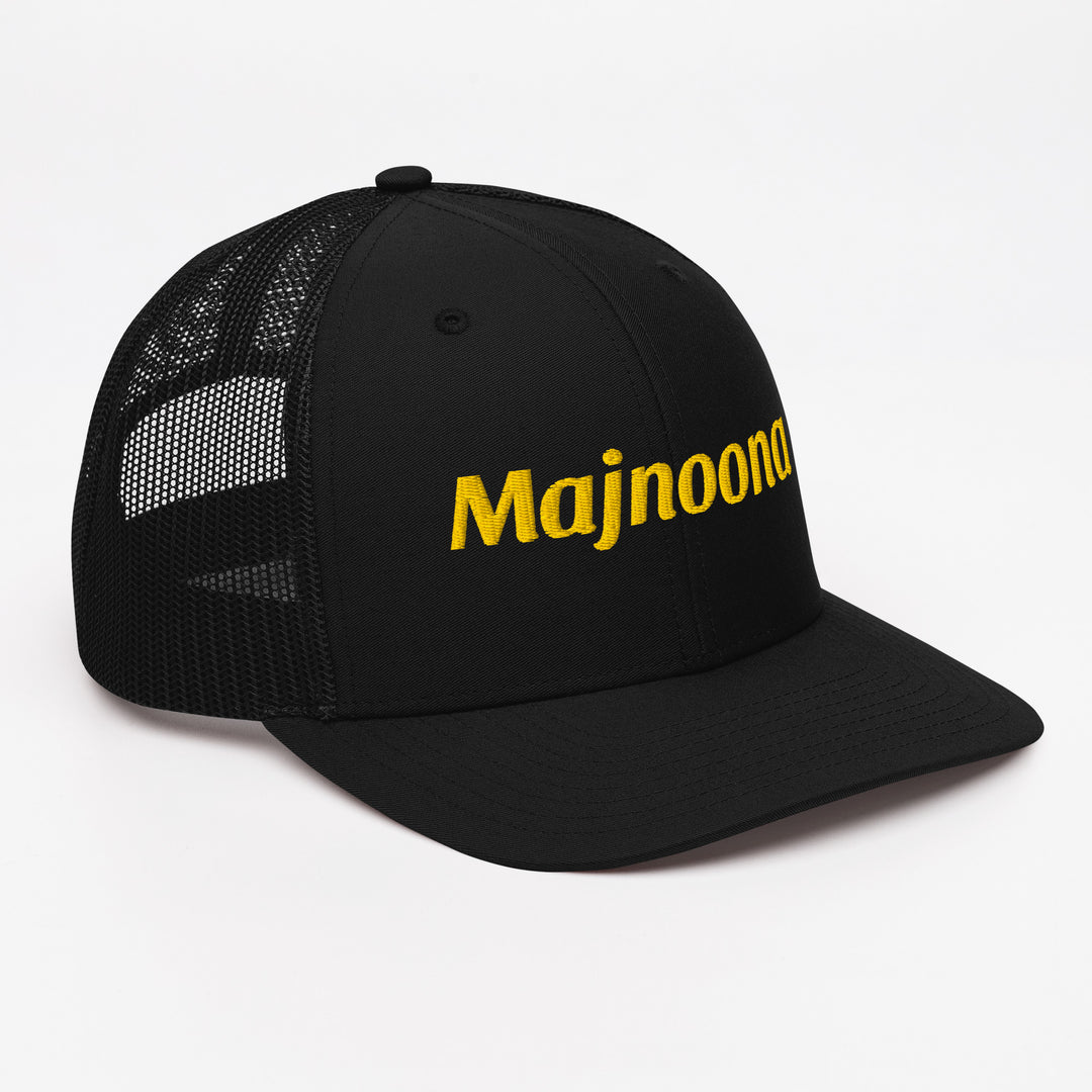 Majnoona snapback trucker cap in black, angled front view, Arabic slogan cap by BOSA