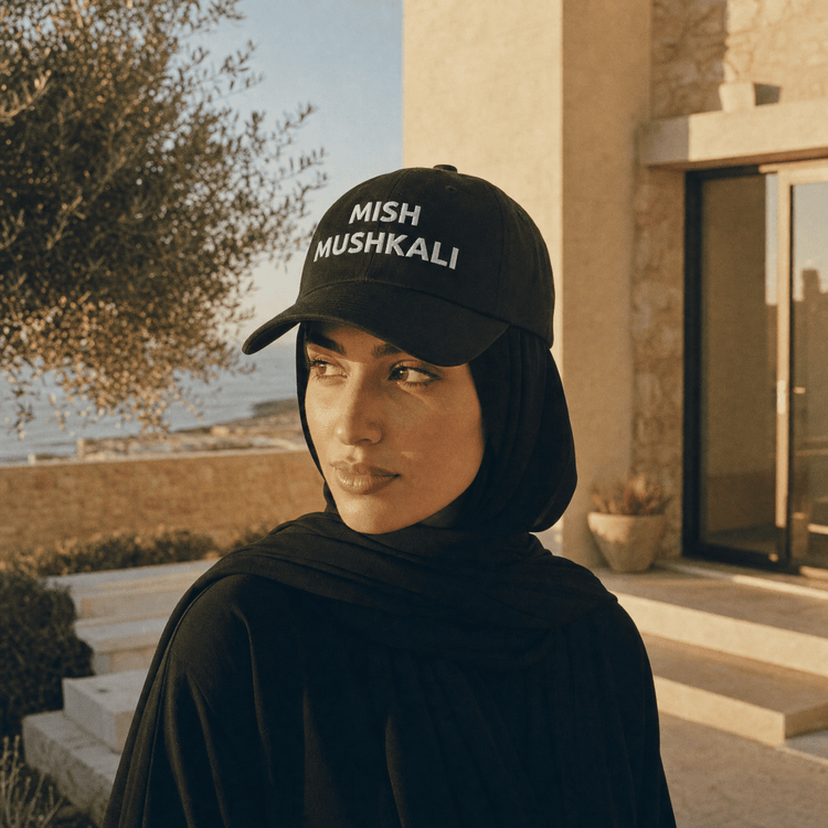 Model wearing Mish Mushkali dad hat, Arab humor cap by BOSA