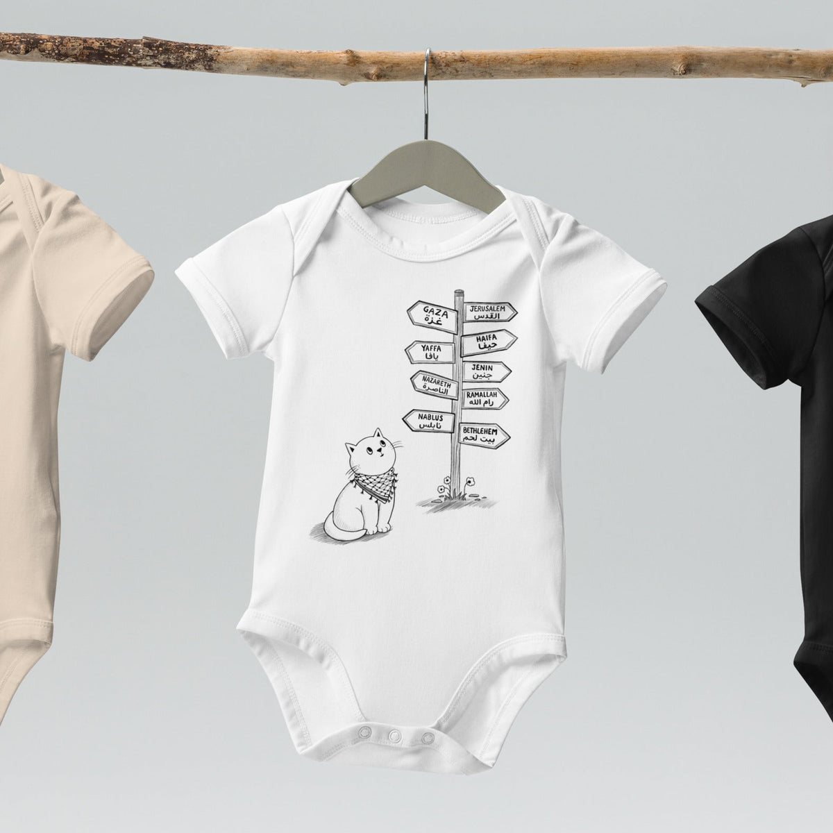 Pali Cat organic cotton onesie in white, front view, Palestinian kuffiyeh cat design by BOSA
