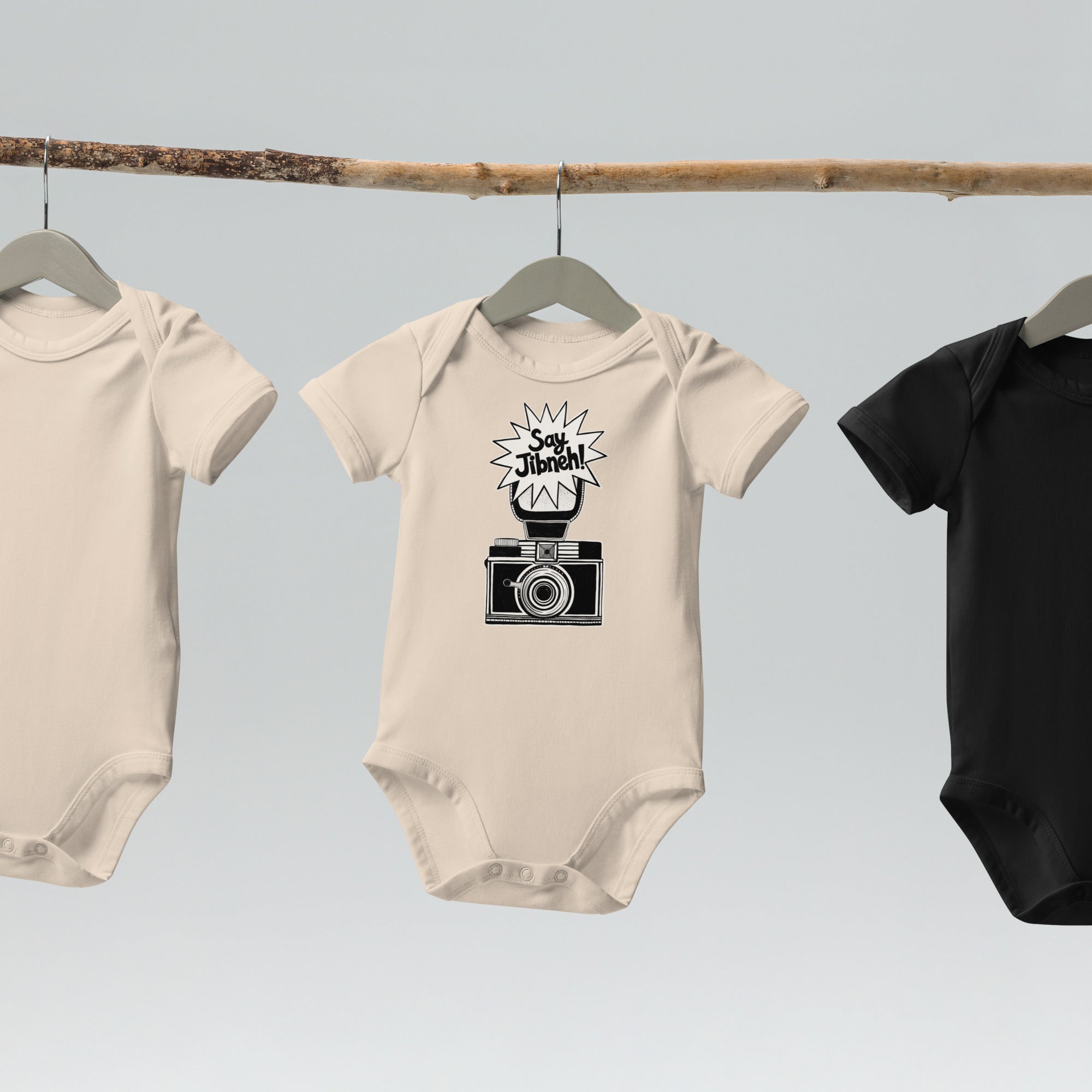 Say Jibneh organic cotton baby bodysuit in natural, front view, Arab food humor baby clothing by BOSA