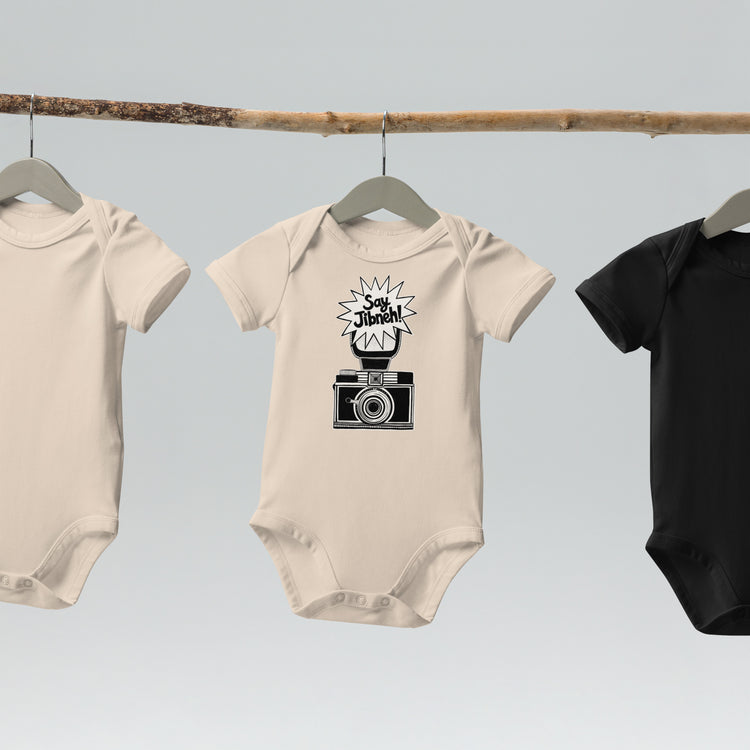 Say Jibneh organic cotton baby bodysuit in natural, front view, Arab food humor baby clothing by BOSA