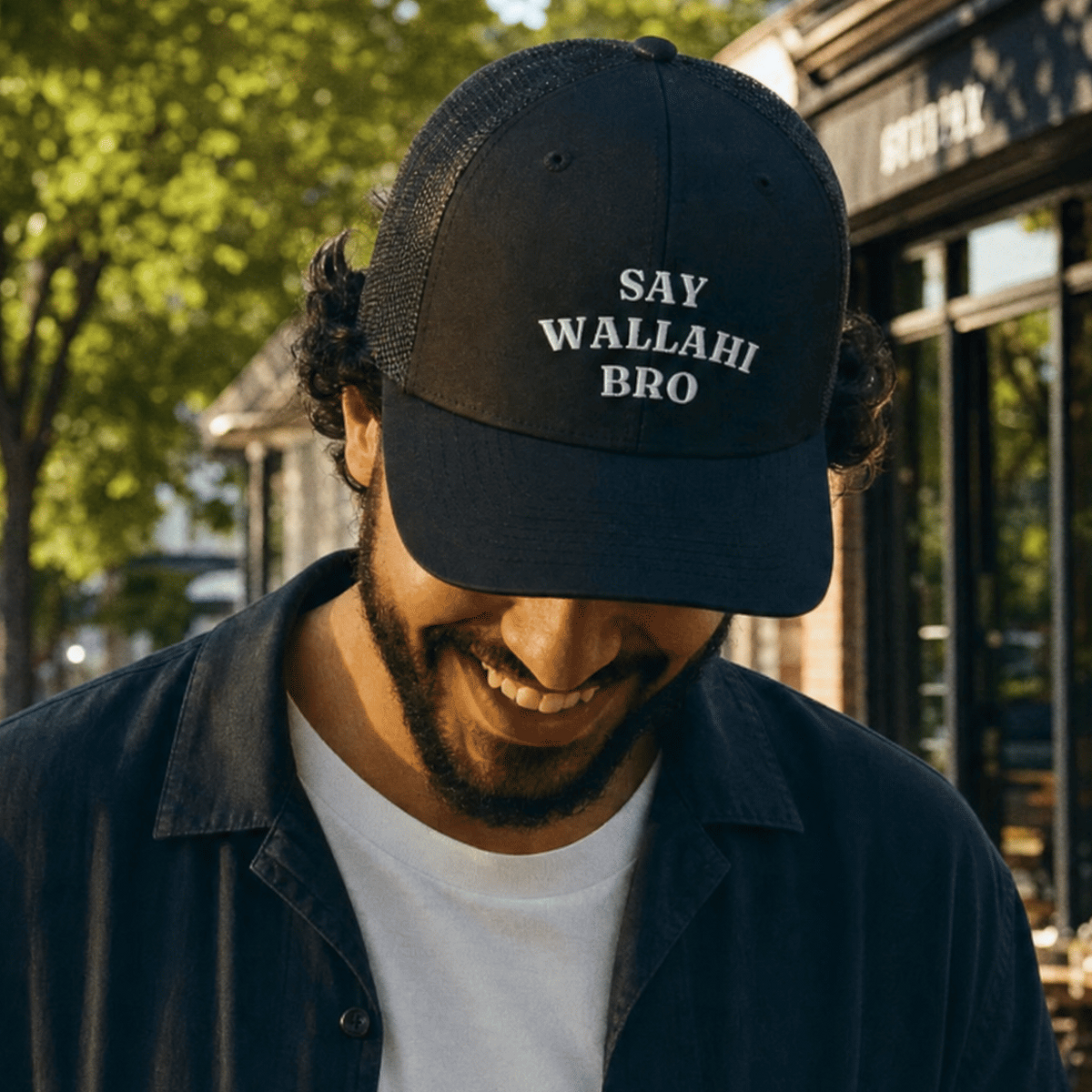 Model wearing Say Wallahi Bro trucker cap, Arab humor headwear by BOSA