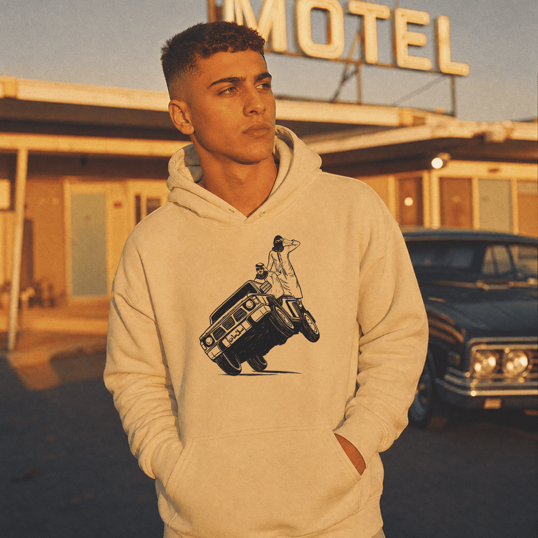 Man wearing Sidewheelie unisex hoodie, Arab car culture streetwear by BOSA